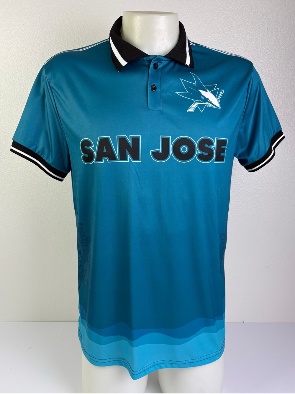 San Jose Sharks 91 SGA Polo Jersey Teal
Idegy Adult XL NHL Promotional